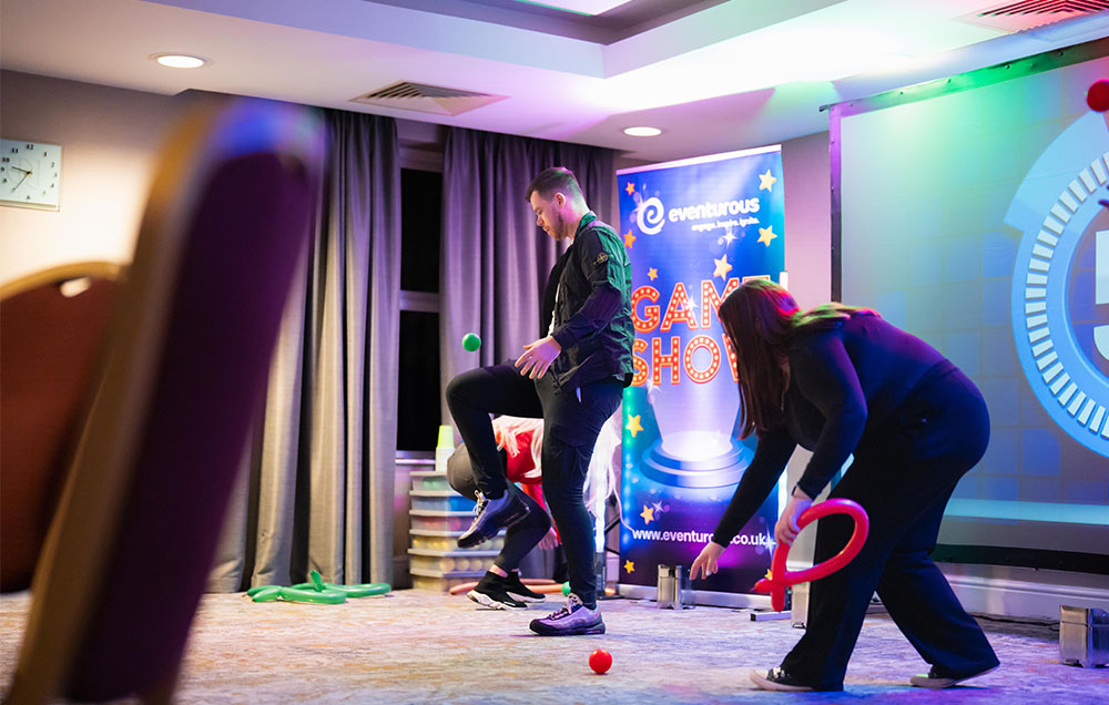 Man kicking a ball up.