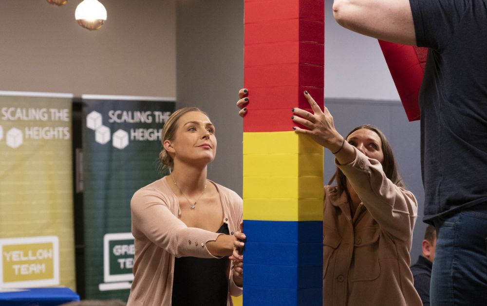 Team mates doing indoor team building.