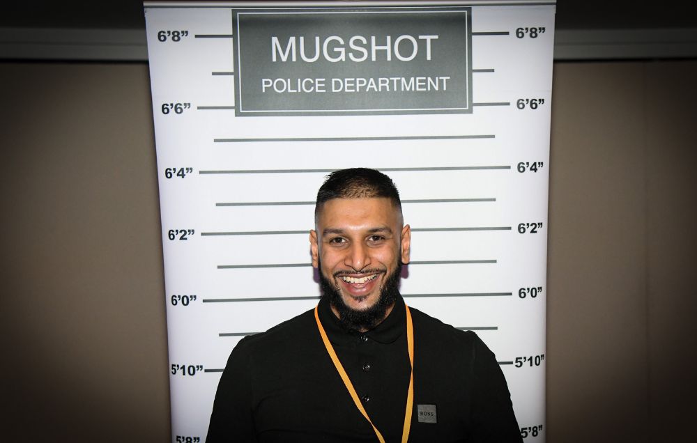 Man having mug shot taken