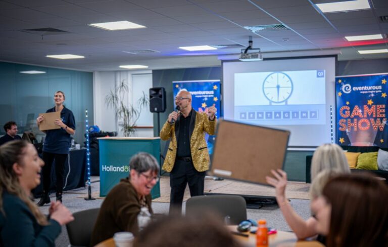 Gameshow host and teams playing