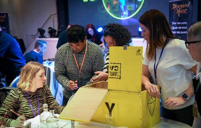 Team gathered around puzzle