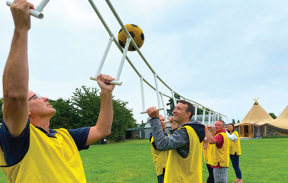 people playing a team building sports activity