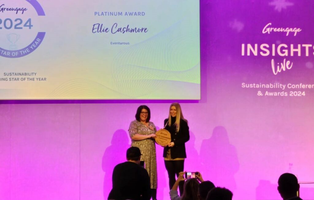 Marketing Manager collecting award on stage