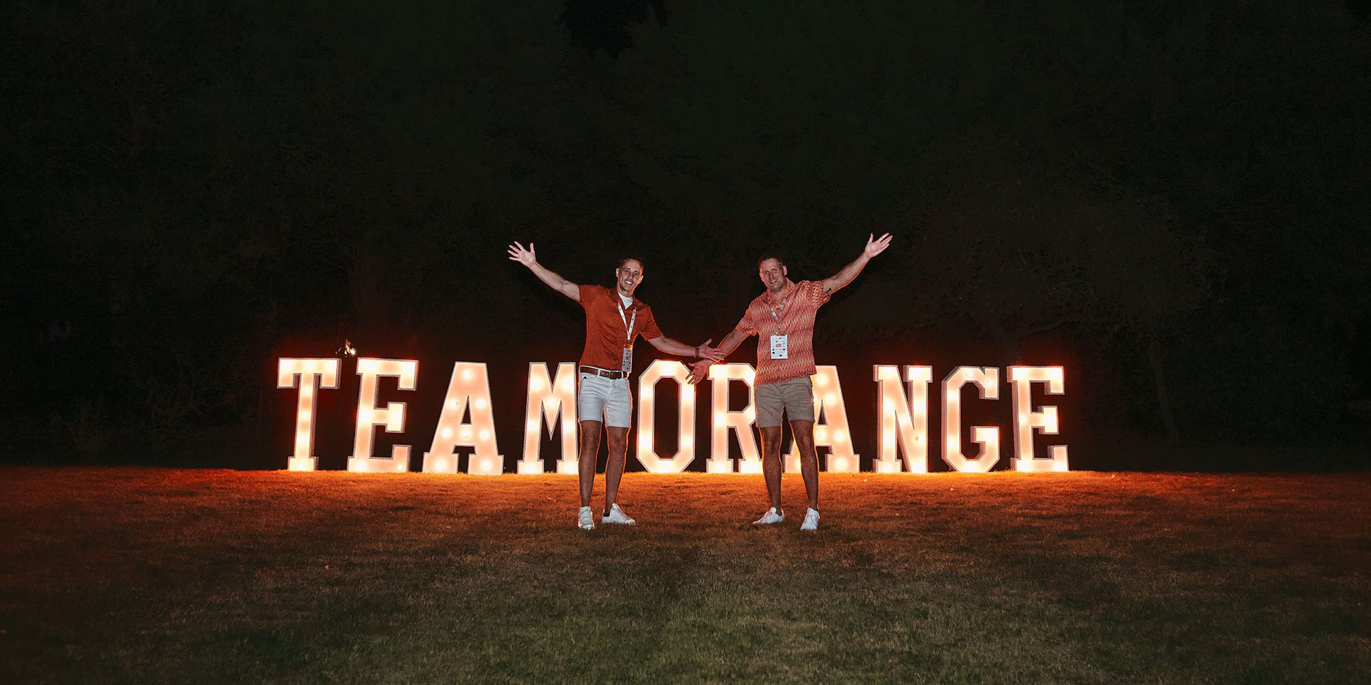 Light up letters in field at festival