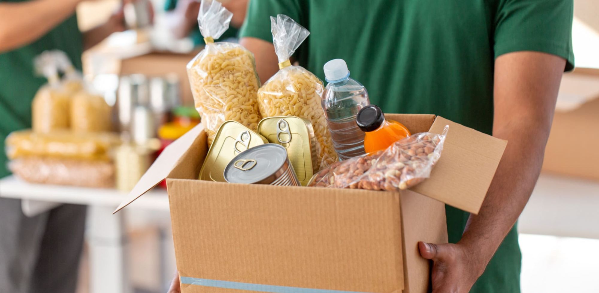Guy carrying food to foodbank