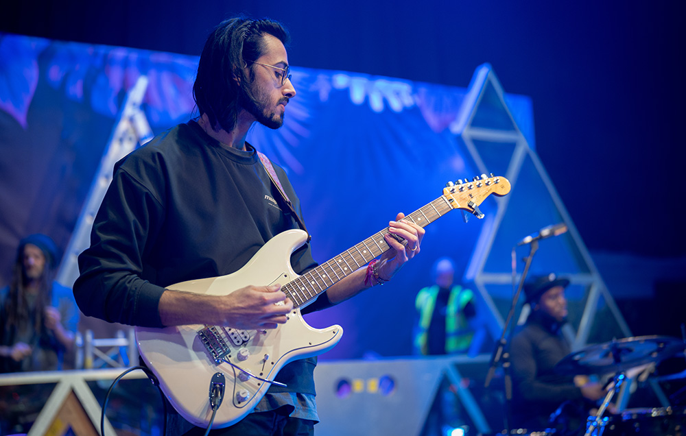 Man Playing guitar on stage