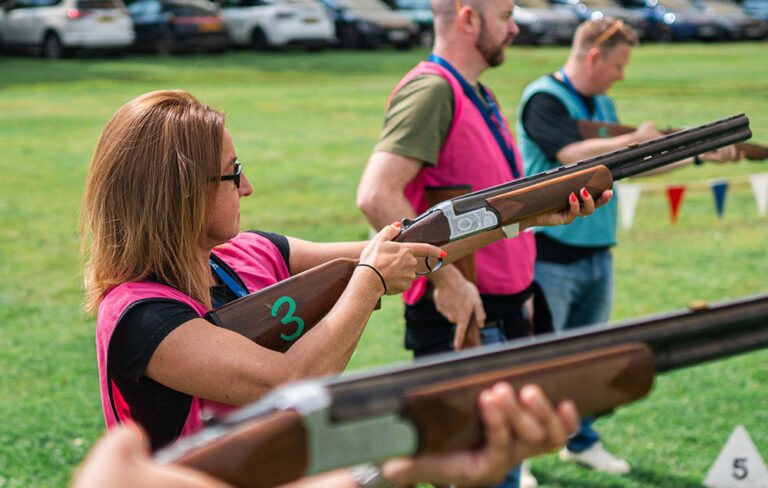 Woman holding laser pigeon shooting gun
