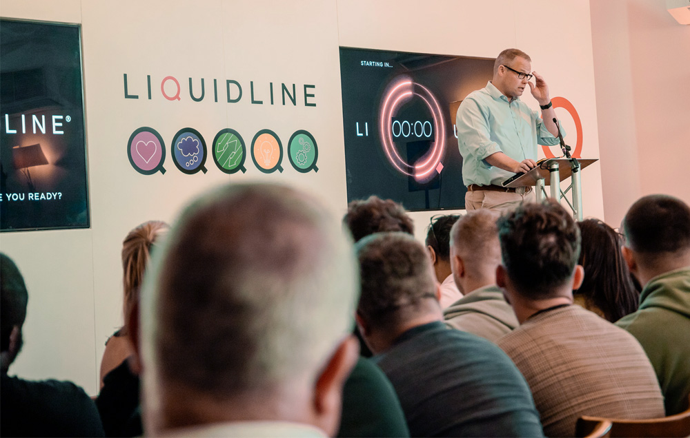 man-at-lectern-talking-at-conference-gallery image