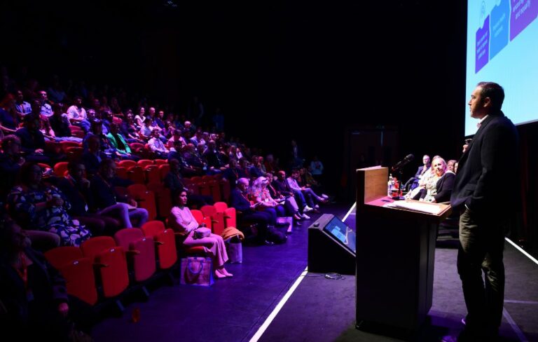 Key note speaker on stage at medical conference