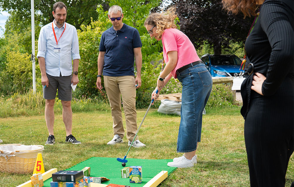 employees playing charity golf in London