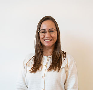 Woman with glasses smiling
