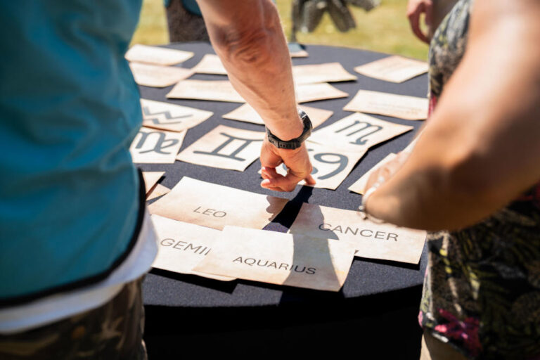 Betrayers outdoor team building event, group working out strategic puzzles
